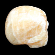 Honey Calcite skull from Pakistan 25*34*33mm 67g in sunlight - Rocks and Things Store
