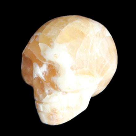 Honey Calcite skull from Pakistan 25*34*33mm 67g in sunlight - Rocks and Things Store