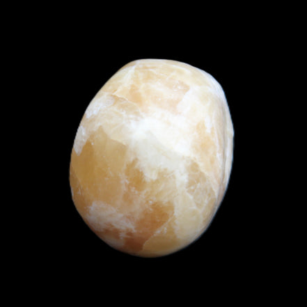 Honey Calcite skull from Pakistan 25*34*33mm 67g in sunlight - Rocks and Things Store
