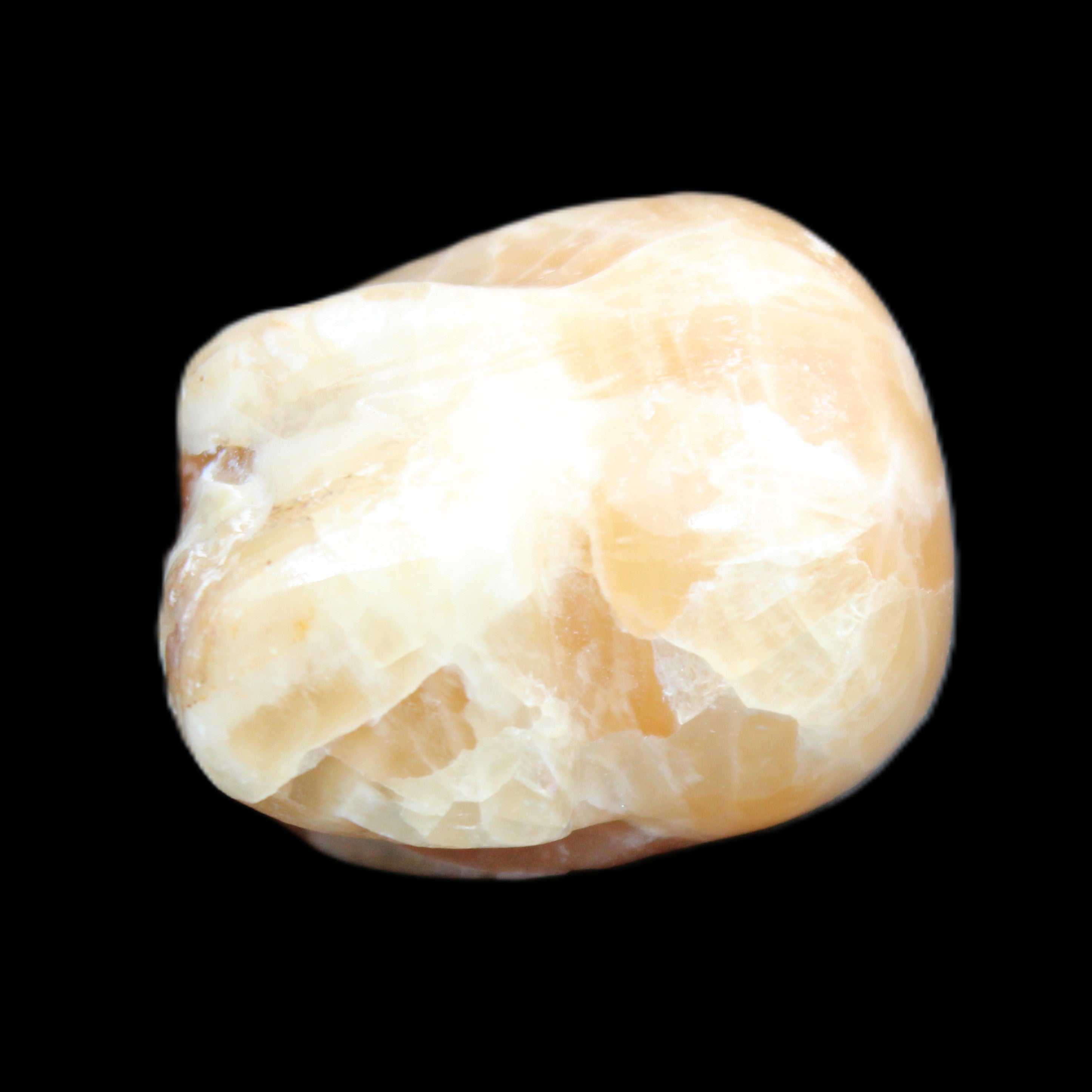 Honey Calcite skull from Pakistan 25*34*33mm 67g in sunlight - Rocks and Things Store