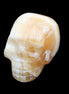 Honey Calcite skull from Pakistan 42*35*37mm 91g in sunlight - Rocks and Things Store