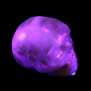 Honey Calcite skull from Pakistan 42*35*37mm 91g in UV light - Rocks and Things Store