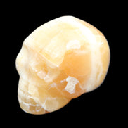 Honey Calcite skull from Pakistan 42*35*37mm 91g in sunlight - Rocks and Things Store