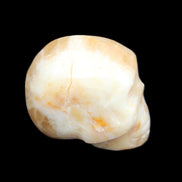 Honey Calcite skull from Pakistan 42*35*37mm 91g in sunlight - Rocks and Things Store