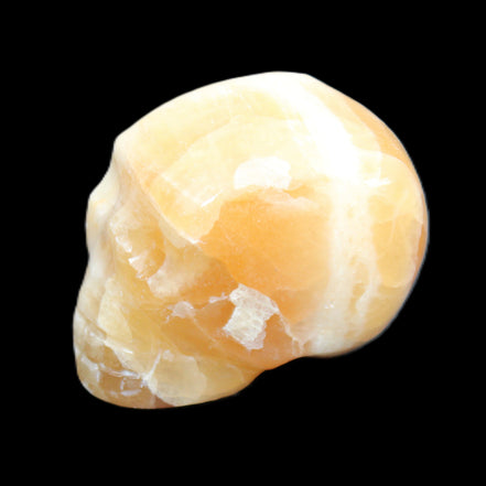 Honey Calcite skull from Pakistan 42*35*37mm 91g in sunlight - Rocks and Things Store