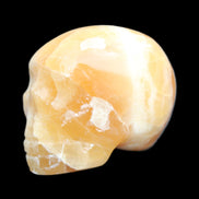 Honey Calcite skull from Pakistan 42*35*37mm 91g in sunlight - Rocks and Things Store