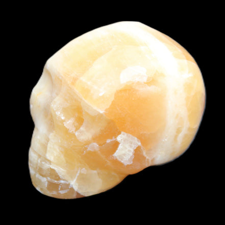 Honey Calcite skull from Pakistan 42*35*37mm 91g in sunlight - Rocks and Things Store