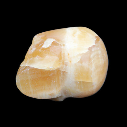 Honey Calcite skull from Pakistan 42*35*37mm 91g in sunlight - Rocks and Things Store
