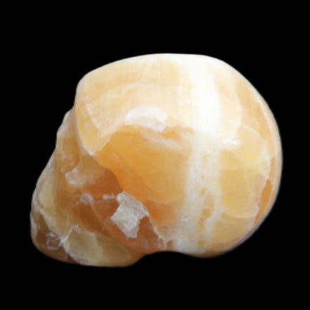 Honey Calcite skull from Pakistan 42*35*37mm 91g in sunlight - Rocks and Things Store