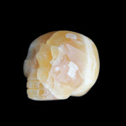 Honey Calcite skull from Pakistan 42*35*37mm 91g in sunlight - Rocks and Things Store