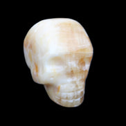 Honey Calcite skull from Pakistan 42*35*37mm 91g in sunlight - Rocks and Things Store