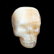 Honey Calcite skull from Pakistan 42*35*37mm 91g in sunlight - Rocks and Things Store
