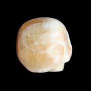 Honey Calcite skull from Pakistan 42*35*37mm 91g in sunlight - Rocks and Things Store
