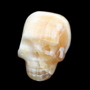 Honey Calcite skull from Pakistan 42*35*37mm 91g in sunlight - Rocks and Things Store