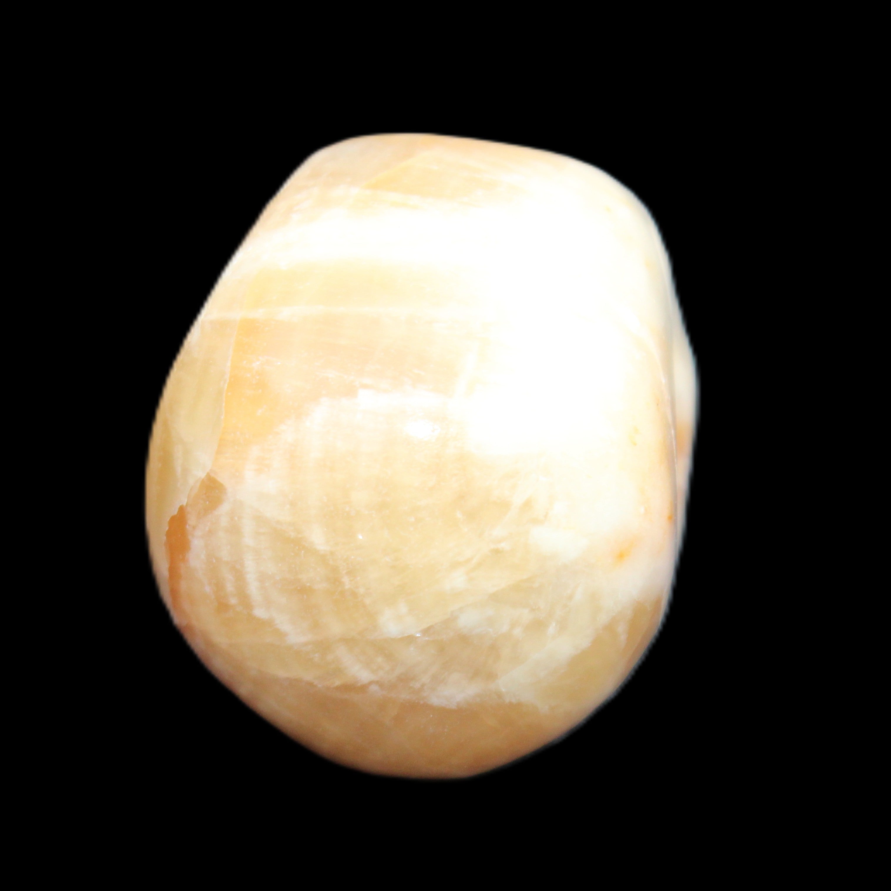 Honey Calcite skull from Pakistan 42*35*37mm 91g in sunlight - Rocks and Things Store