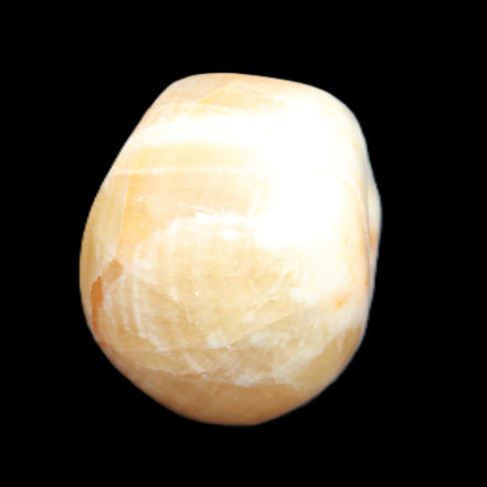 Honey Calcite skull from Pakistan 42*35*37mm 91g in sunlight - Rocks and Things Store