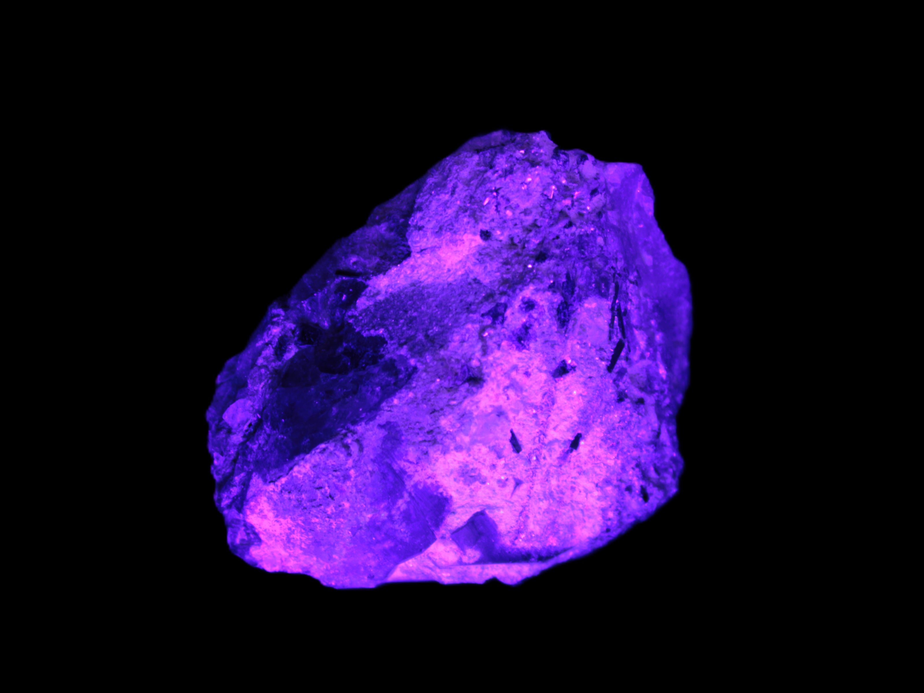 Green Tourmaline crystals on Clear Quartz from Skardu in UV light