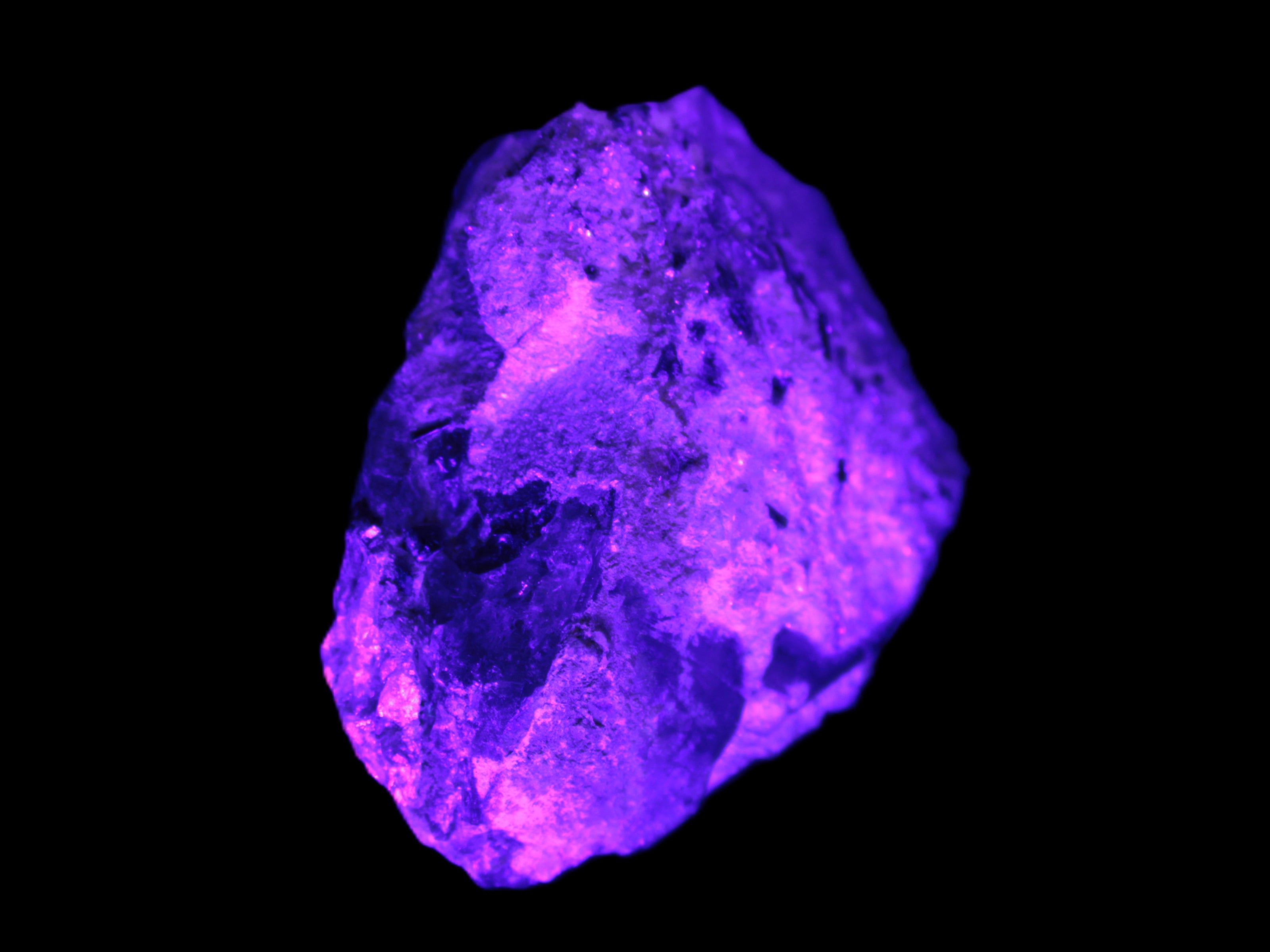 Green Tourmaline crystals on Clear Quartz from Skardu in UV light