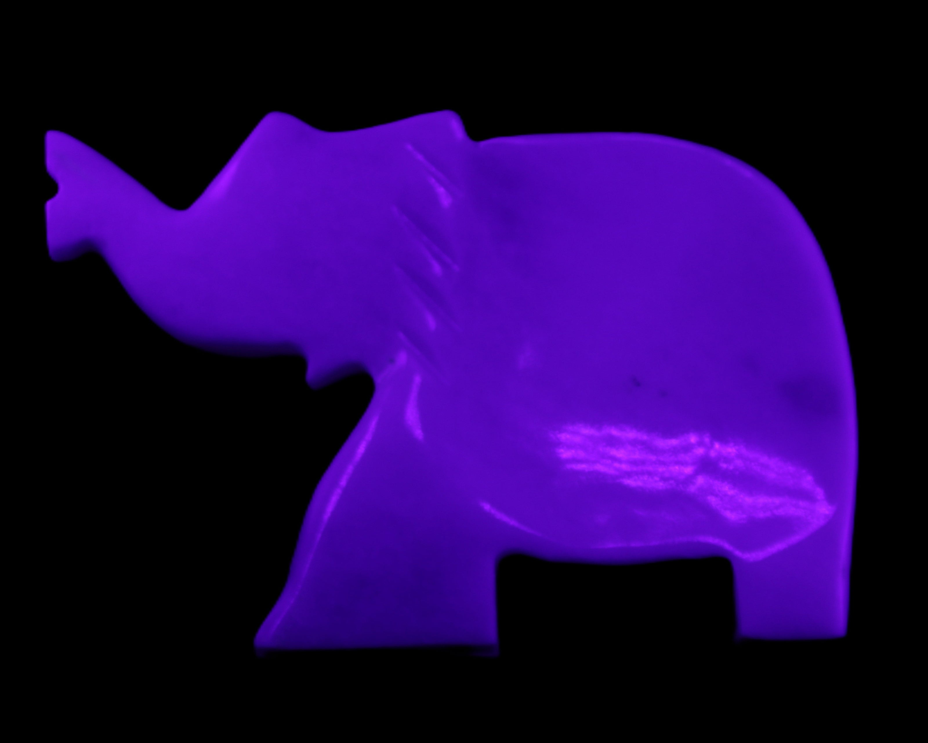 White Jade hand-carved Elephant platter 149*100*24mm 458g in UV light - Rocks and Things Store