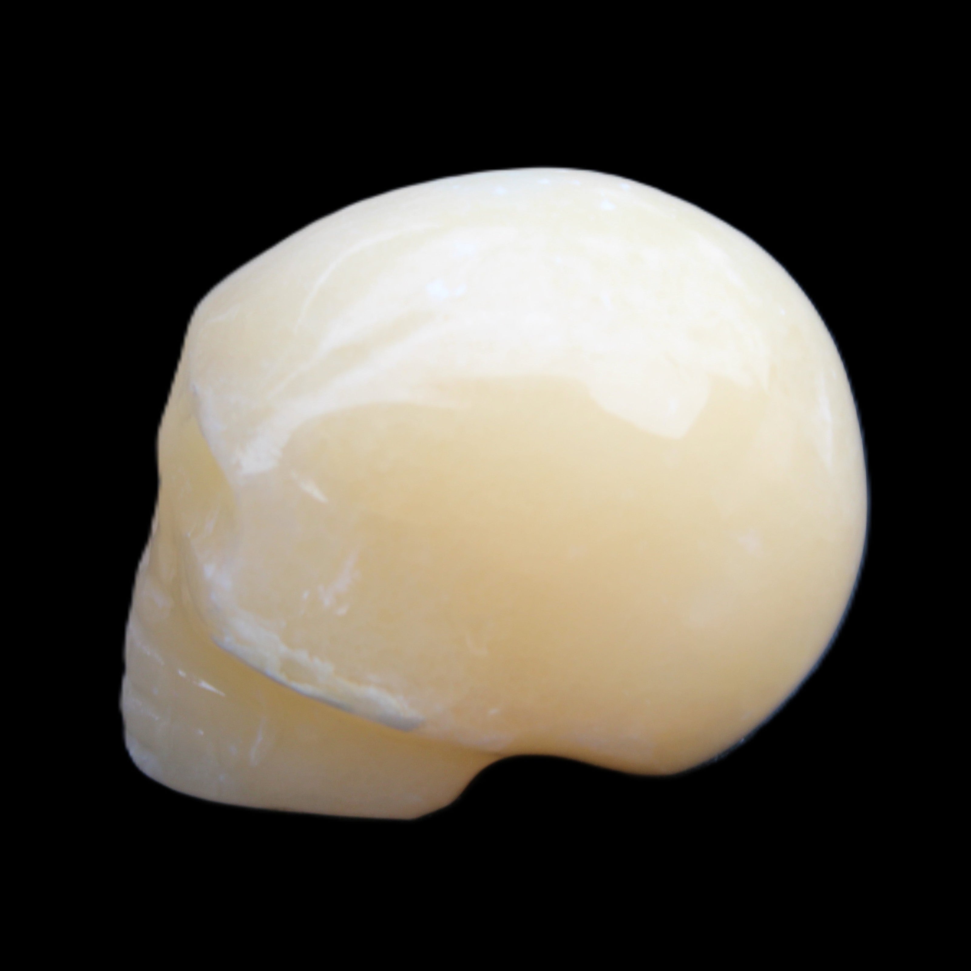 Lemon Calcite skull 33*46*37mm 94g in sunlight - Rocks and Things Store