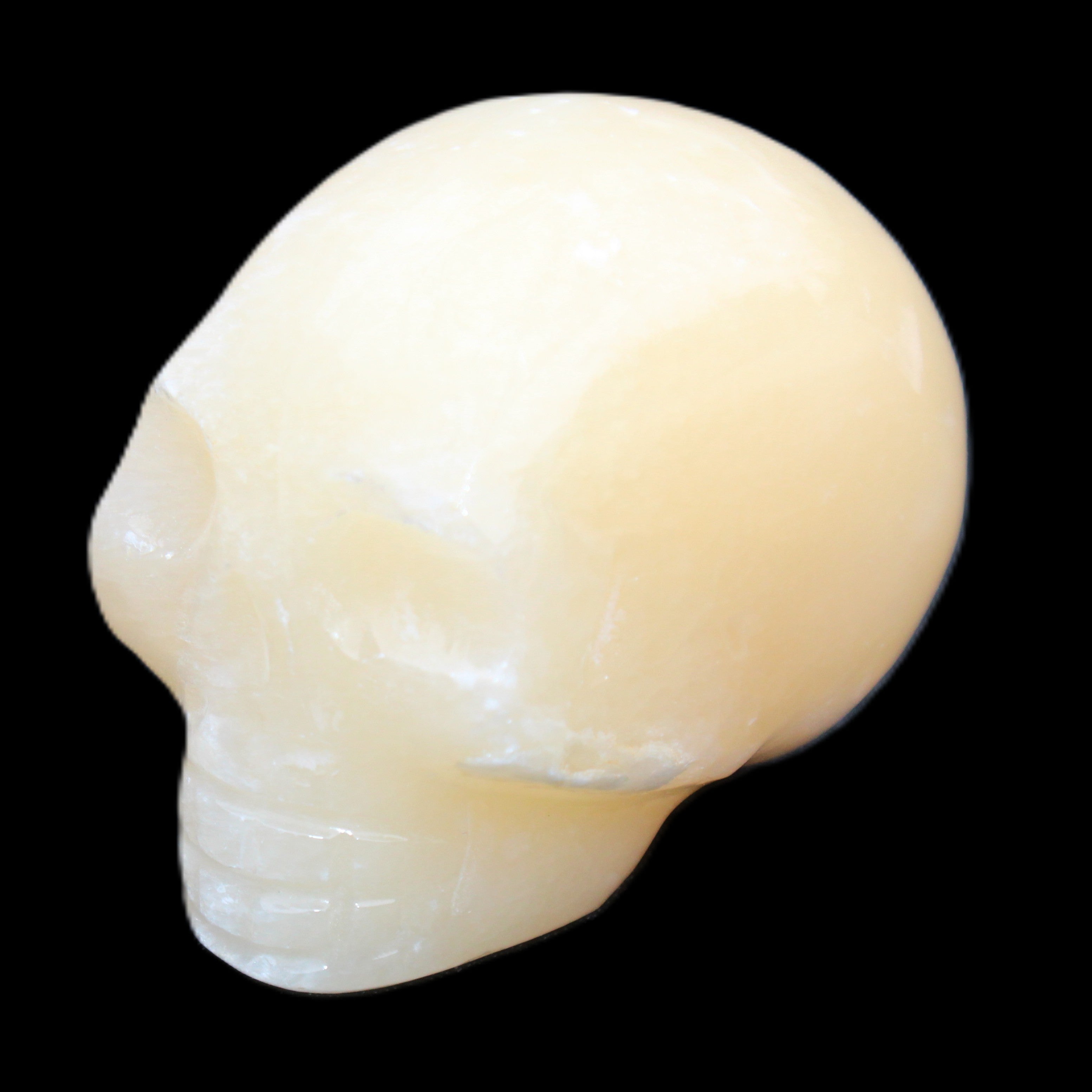 Lemon Calcite skull 33*46*37mm 94g in sunlight - Rocks and Things Store