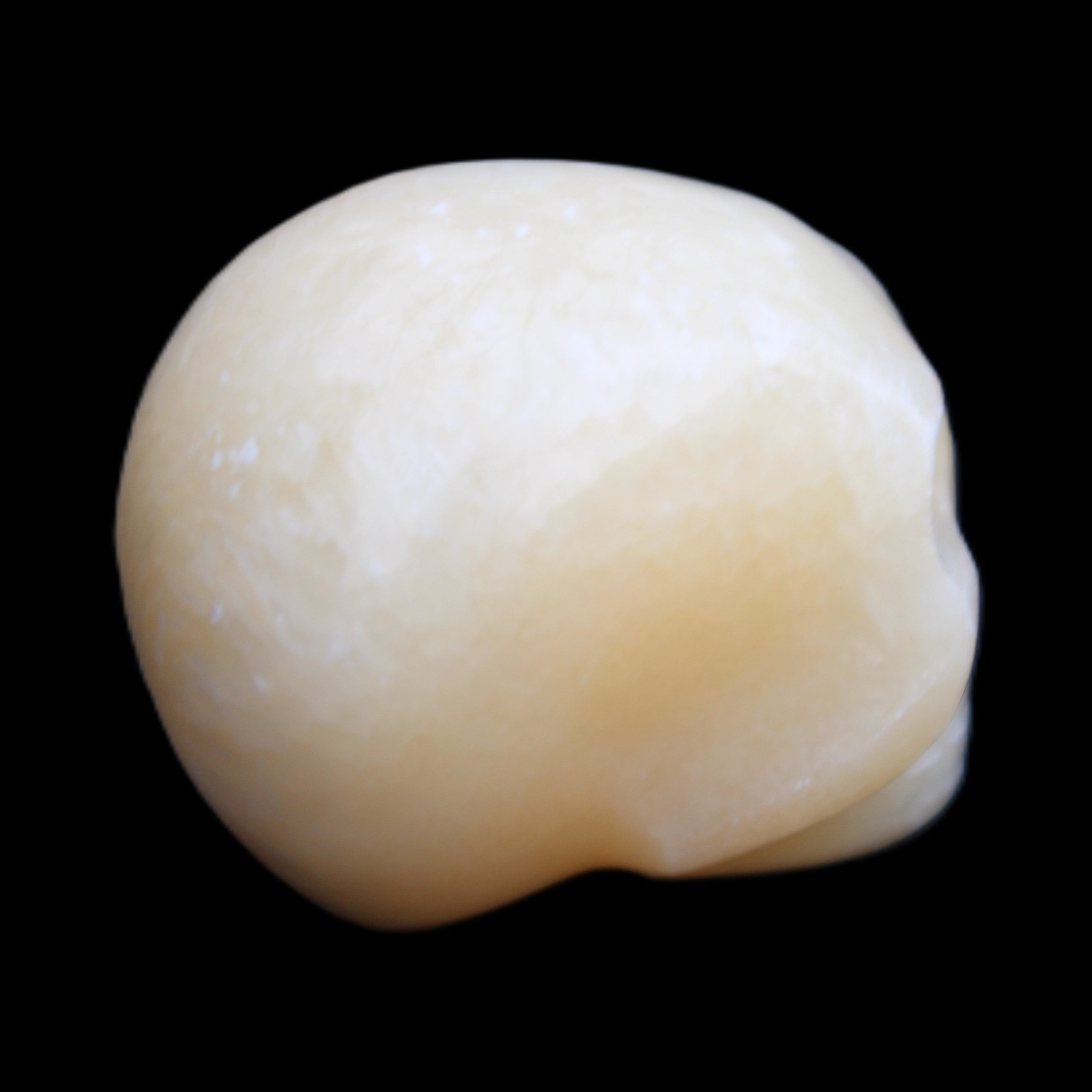 Lemon Calcite skull 33*46*37mm 94g in sunlight - Rocks and Things Store