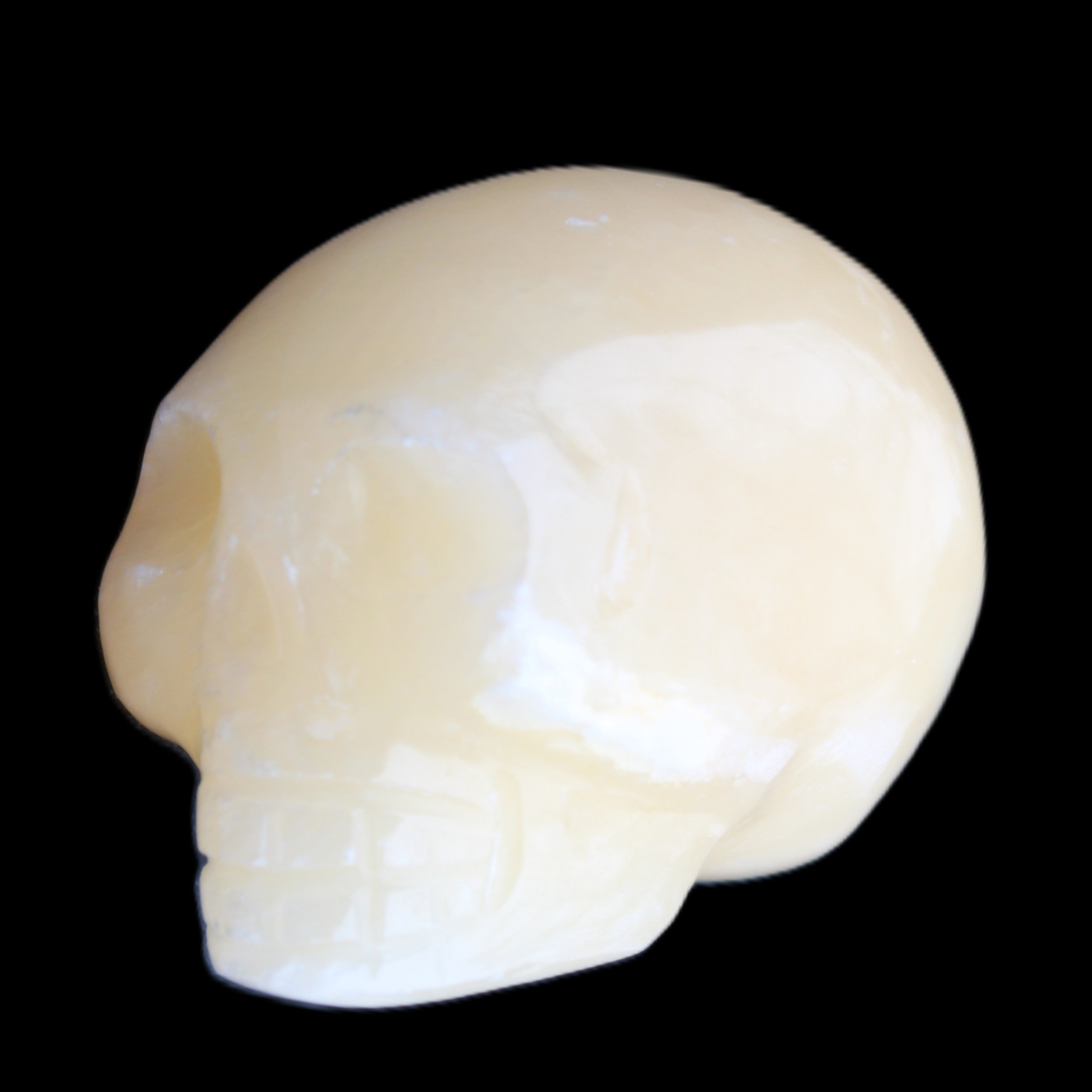 Lemon Calcite skull 33*46*37mm 94g in sunlight - Rocks and Things Store