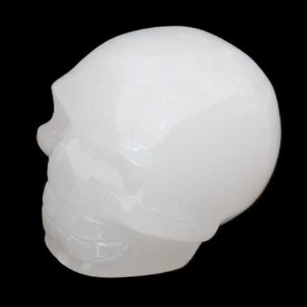 Mangano Calcite skull 45*52*48mm 196g in sunlight - Rocks and Things Store