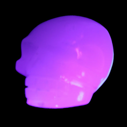 Mangano Calcite skull 45*52*48mm 196g in UV light - Rocks and Things Store