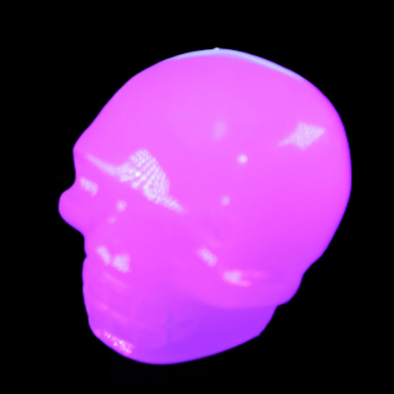 Mangano Calcite skull 45*52*48mm 196g in UV light - Rocks and Things Store