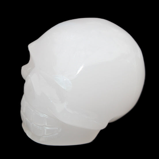 Mangano Calcite skull 45*52*48mm 196g in sunlight - Rocks and Things Store