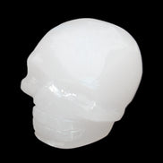 Mangano Calcite skull 45*52*48mm 196g in sunlight - Rocks and Things Store