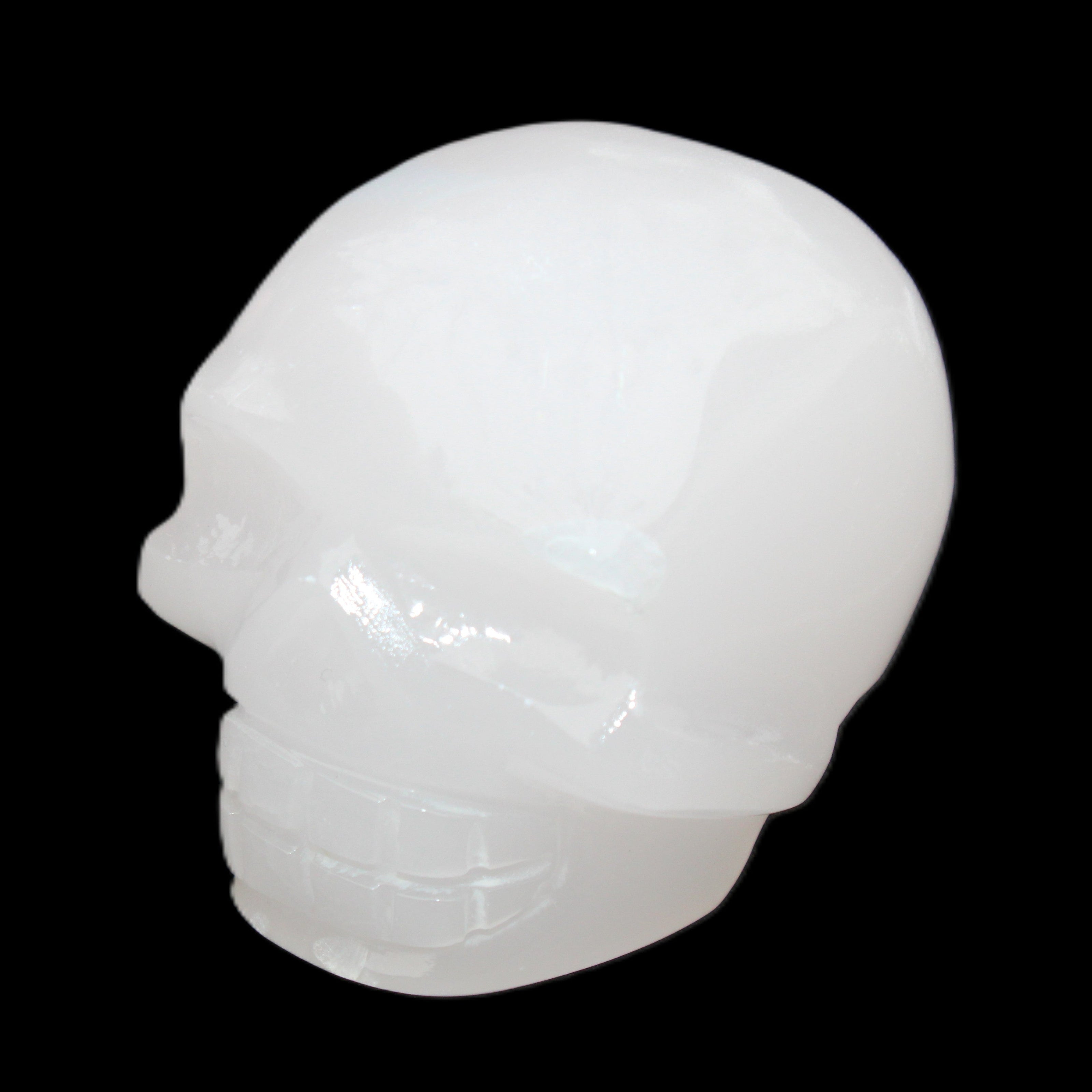 Mangano Calcite skull 45*52*48mm 196g in sunlight - Rocks and Things Store