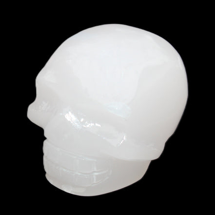 Mangano Calcite skull 45*52*48mm 196g in sunlight - Rocks and Things Store