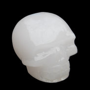 Mangano Calcite skull 45*52*48mm 196g in sunlight - Rocks and Things Store