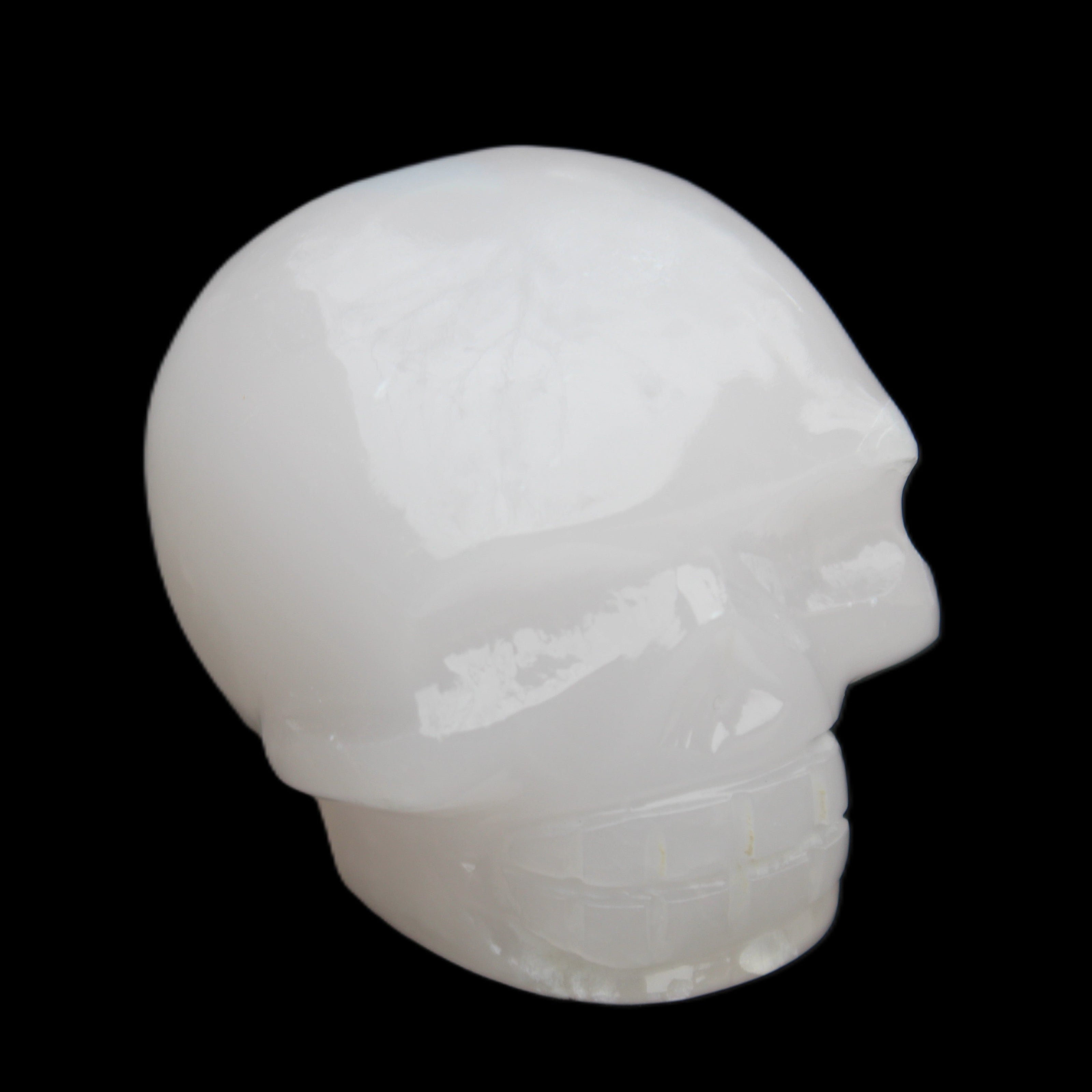 Mangano Calcite skull 45*52*48mm 196g in sunlight - Rocks and Things Store