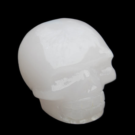 Mangano Calcite skull 45*52*48mm 196g in sunlight - Rocks and Things Store