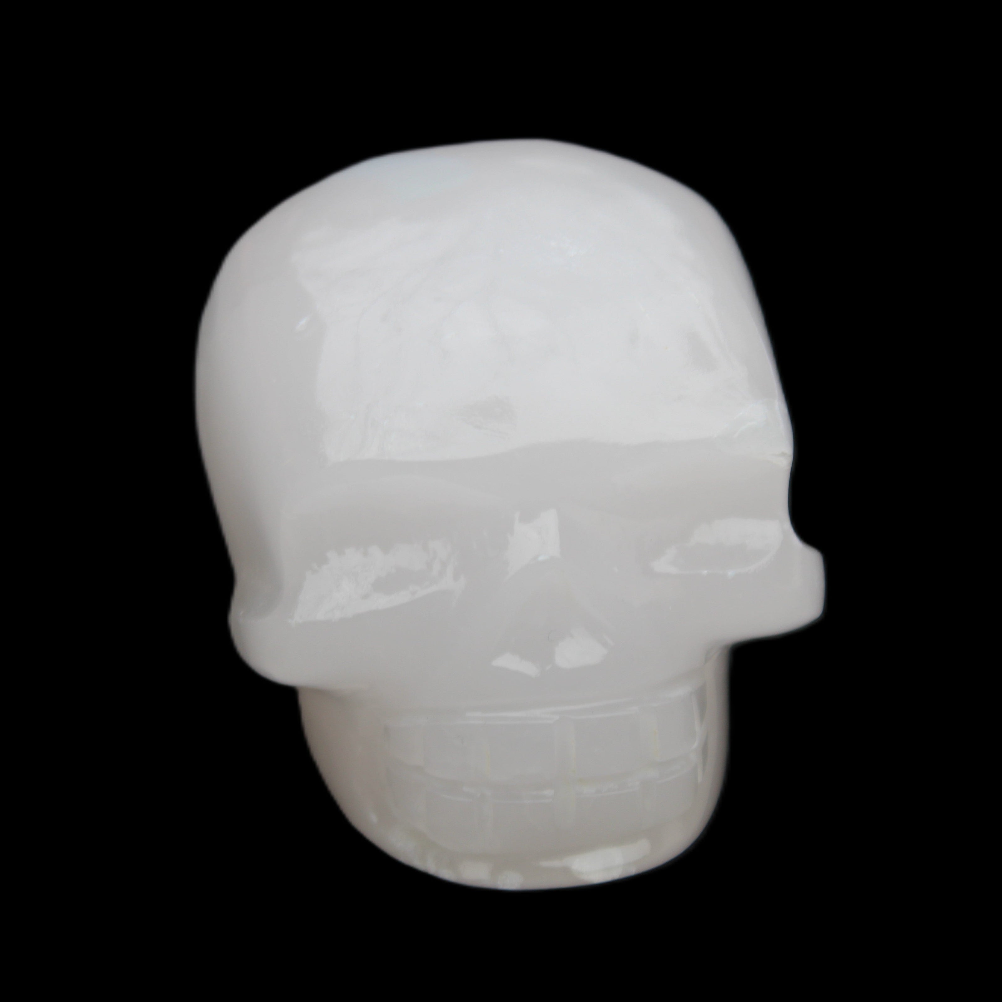 Mangano Calcite skull 45*52*48mm 196g in sunlight - Rocks and Things Store