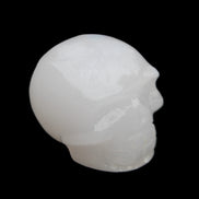 Mangano Calcite skull 45*52*48mm 196g in sunlight - Rocks and Things Store