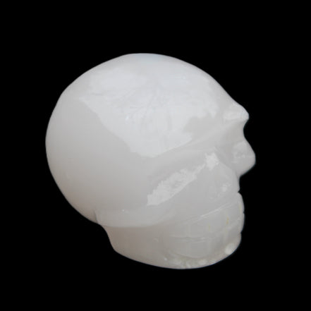 Mangano Calcite skull 45*52*48mm 196g in sunlight - Rocks and Things Store