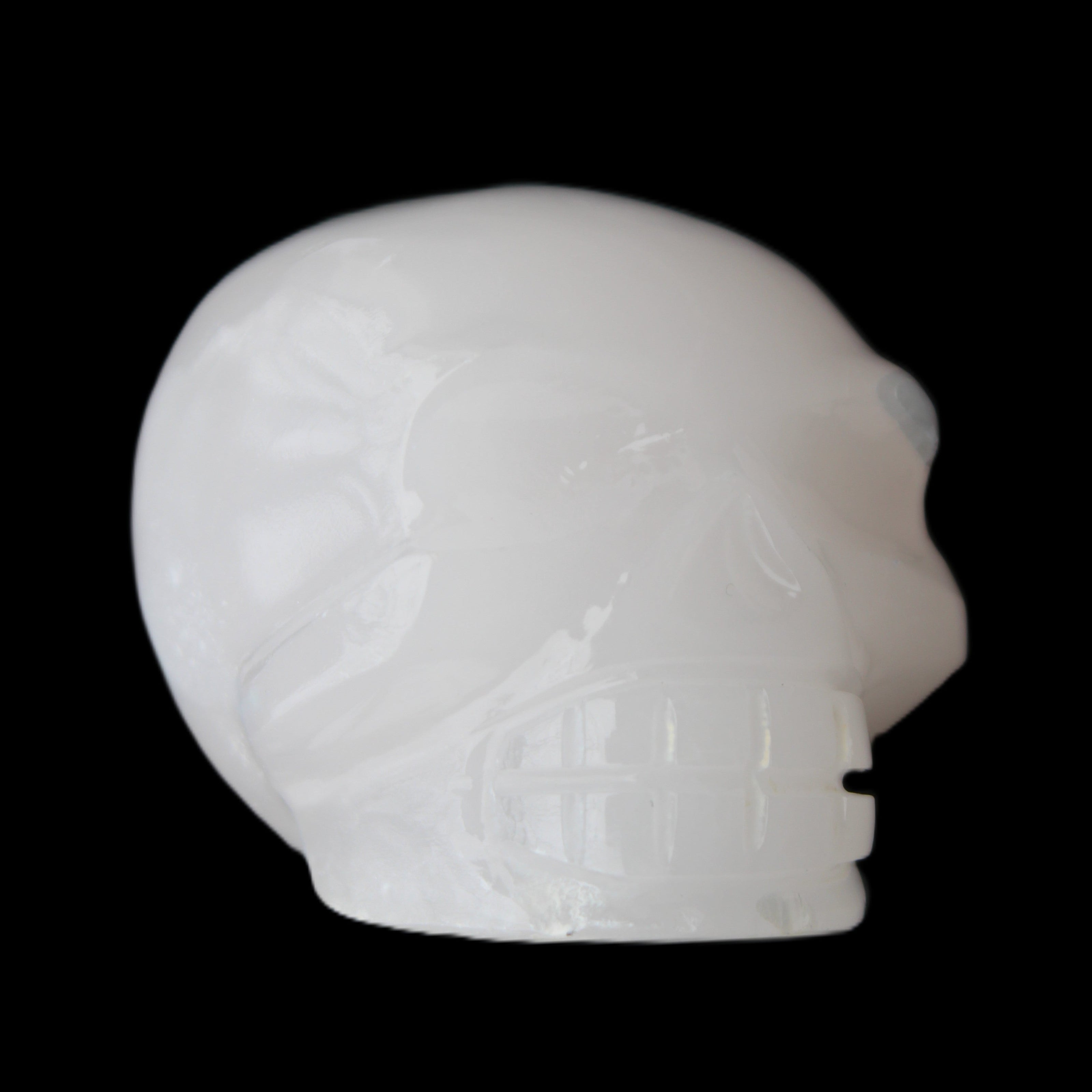 Mangano Calcite skull 45*52*48mm 196g in sunlight - Rocks and Things Store