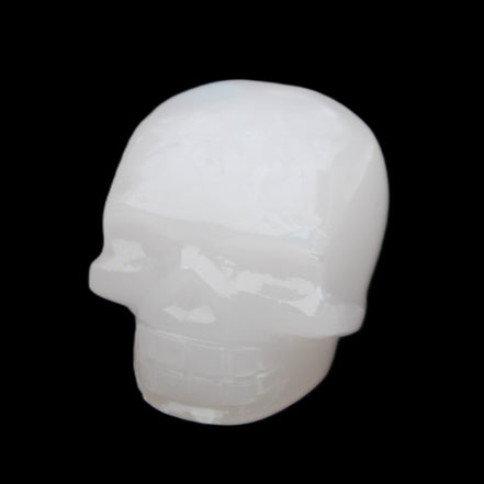 Mangano Calcite skull 45*52*48mm 196g in sunlight - Rocks and Things Store