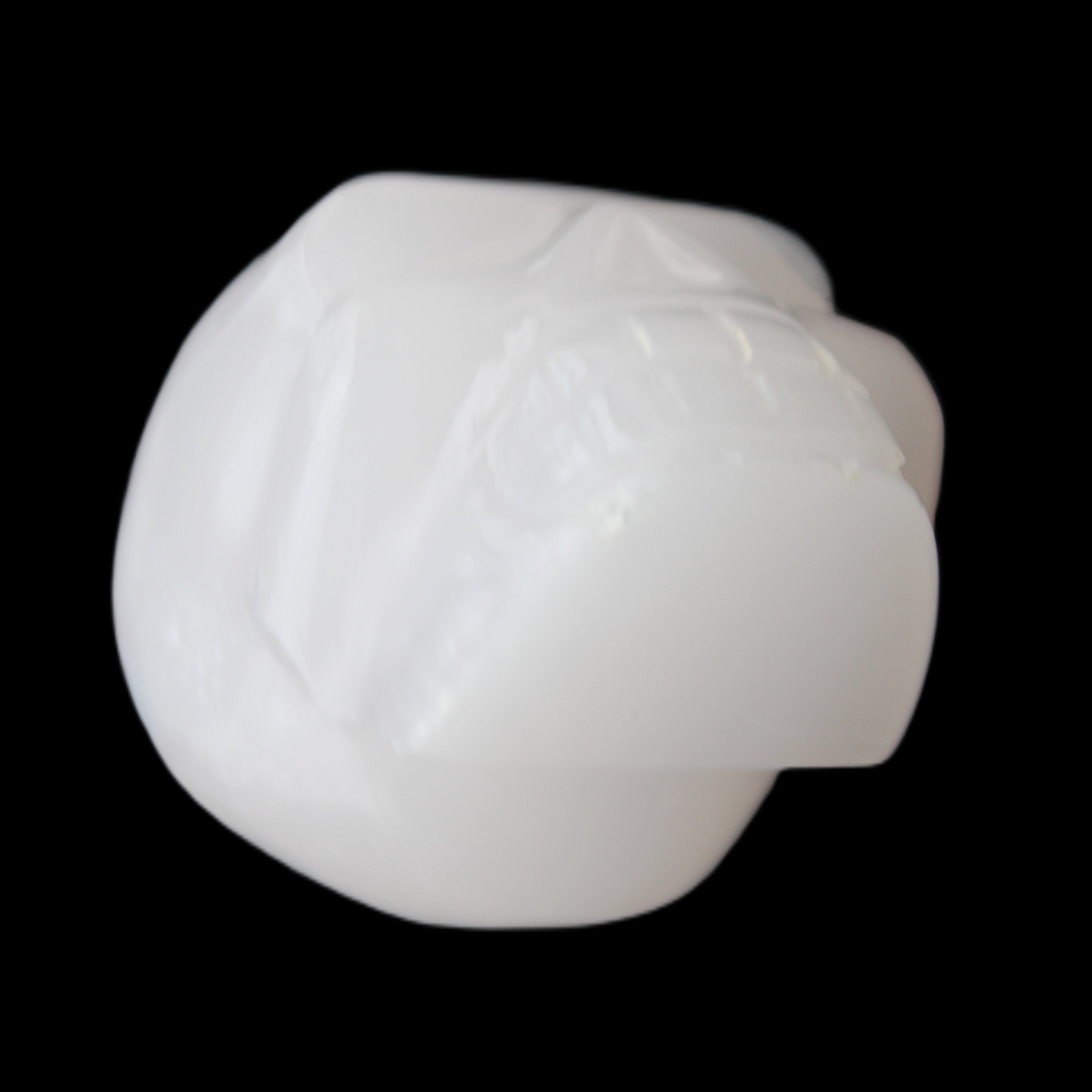 Mangano Calcite skull 45*52*48mm 196g in sunlight - Rocks and Things Store