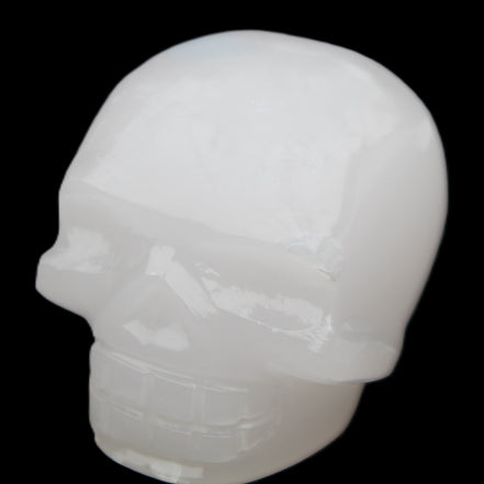Mangano Calcite skull 45*52*48mm 196g in sunlight - Rocks and Things Store