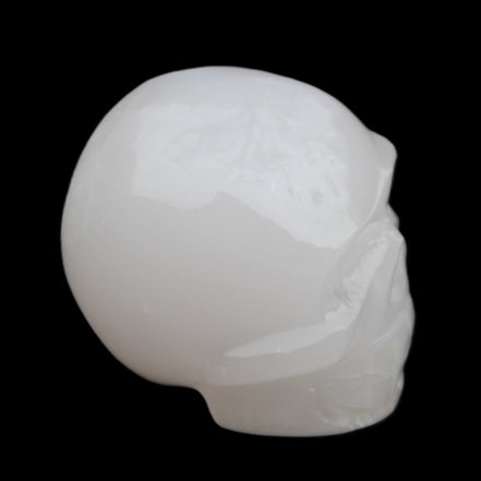 Mangano Calcite skull 45*52*48mm 196g in sunlight - Rocks and Things Store