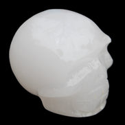 Mangano Calcite skull 45*52*48mm 196g in sunlight - Rocks and Things Store