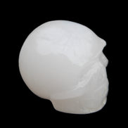 Mangano Calcite skull 45*52*48mm 196g in sunlight - Rocks and Things Store