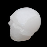 Mangano Calcite skull 45*52*48mm 196g in sunlight - Rocks and Things Store