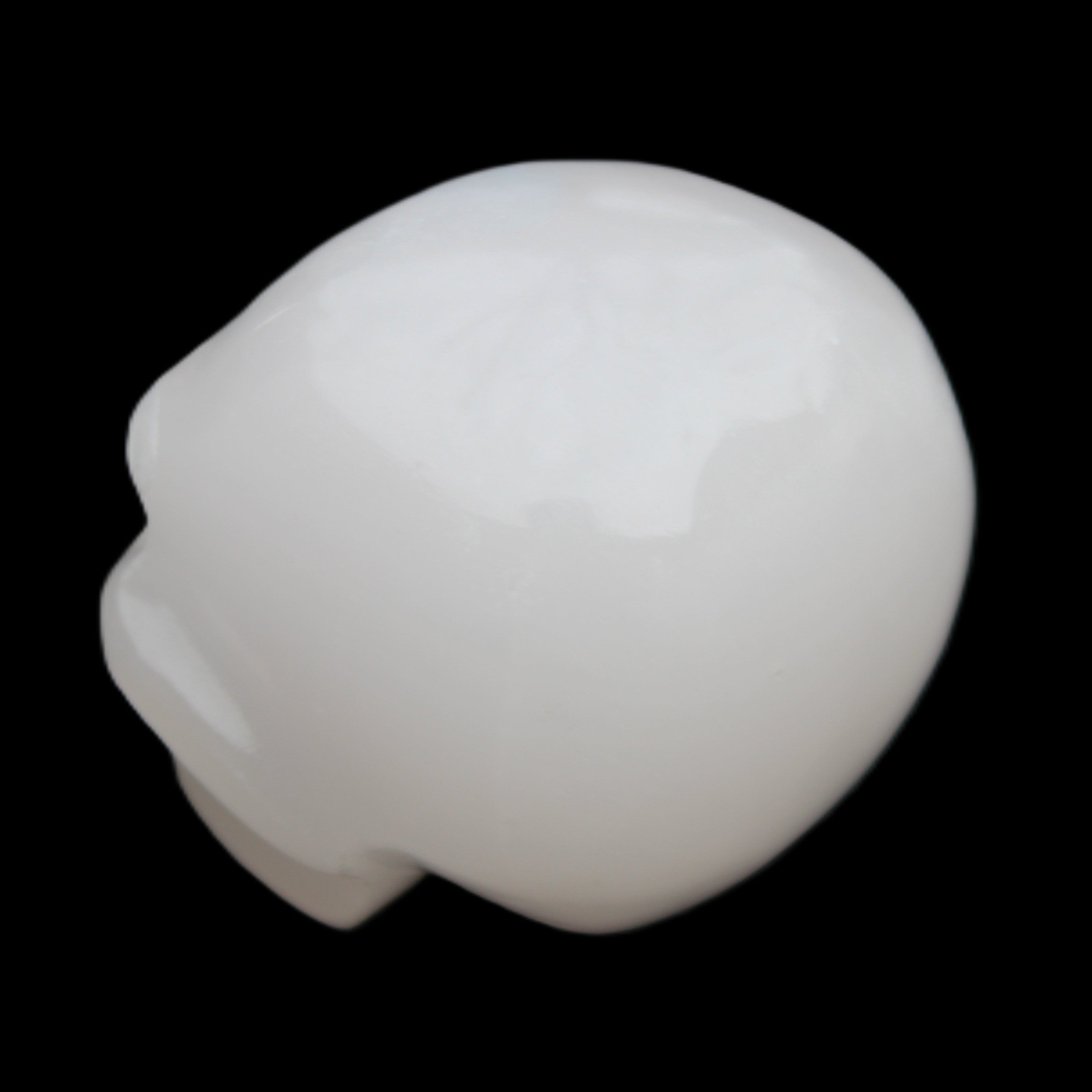 Mangano Calcite skull 45*52*48mm 196g in sunlight - Rocks and Things Store