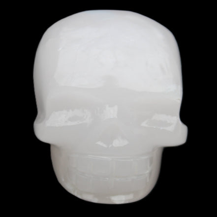 Mangano Calcite skull 45*52*48mm 196g in sunlight - Rocks and Things Store